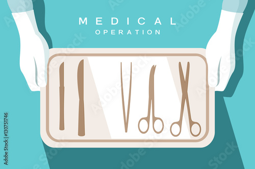 Assistant of the surgeon holds surgical instruments