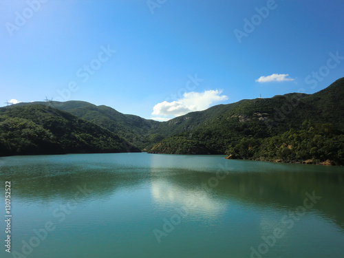 Beautiful placid lake with forest in Hong Kong park
