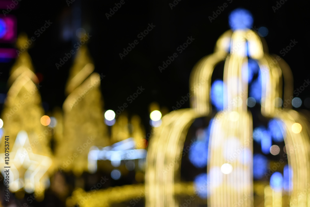Blurred image bokeh : Christmas tree background at night at Thailand Christmas and New year Market.