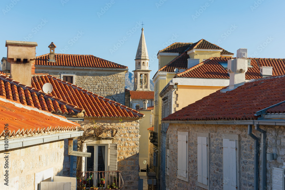 Red roofs with bell tower of St. John Church.  Old Town of Budva. Montenegro