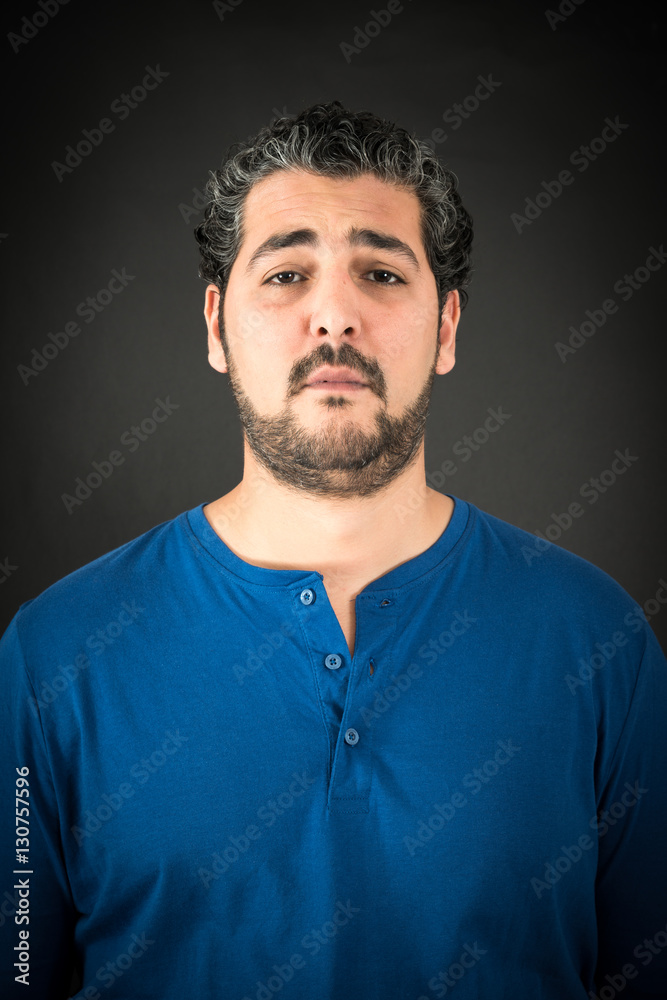 Handsome man doing different expressions in different sets of clothes: sad Handsome man doing different expressions in different sets of clothes: sad