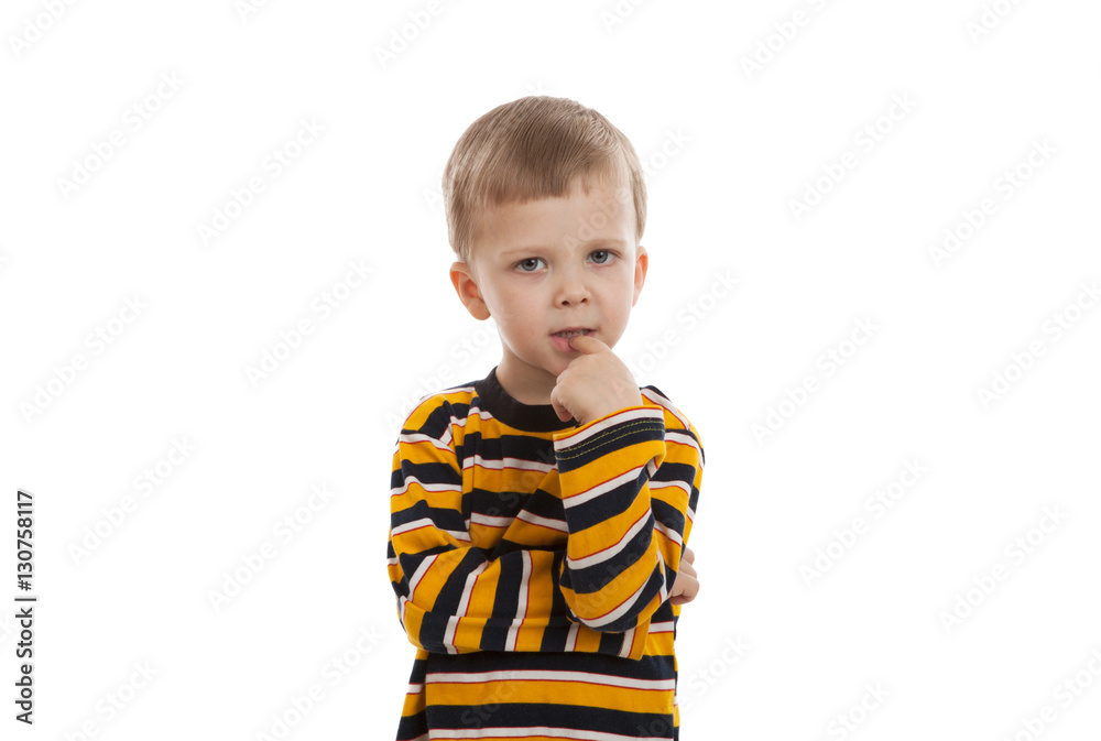little boy standing in a striped T-shirt little boy standing in a striped T-shirt