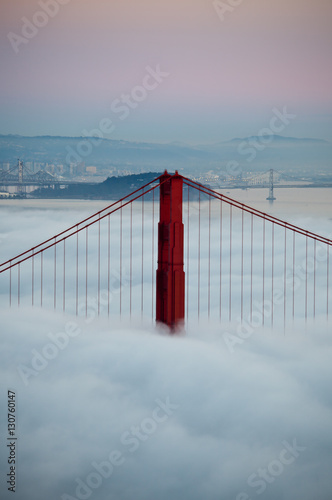 Fototapeta Naklejka Na Ścianę i Meble -  Thick fog covering Golden Gate Bridge.
