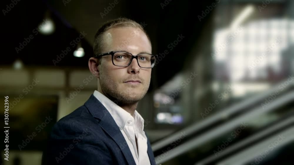 young handsome businessman moving into the light. young handsome businessman moving into the light.