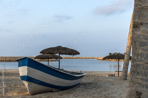 Boat on the beach in salalah oman sunrise time