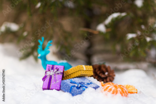 Christmas presents under the Christmas tree in the snow photo