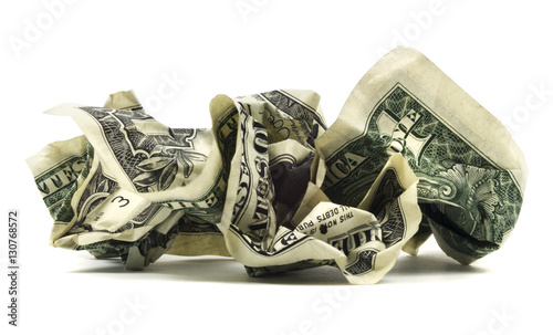 Isolated crumpled dollar bills on a white background.