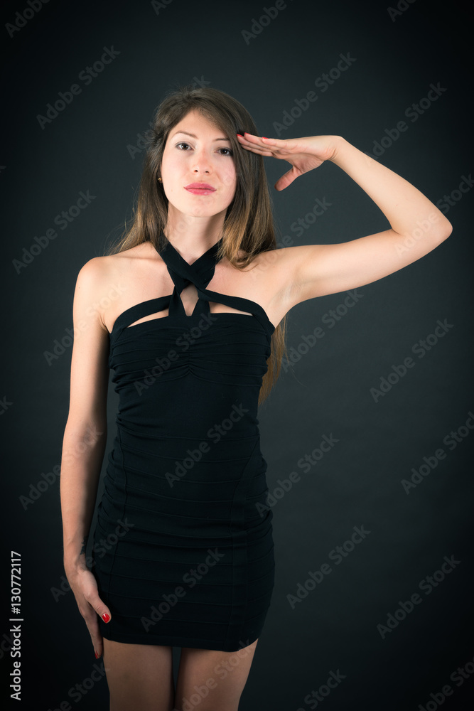 Beautiful woman doing different expressions in different sets of clothes: at attention Beautiful woman doing different expressions in different sets of clothes: at attention