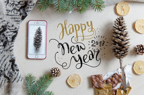 Christmas and New Year flat lay background with hand lettering greeting. 