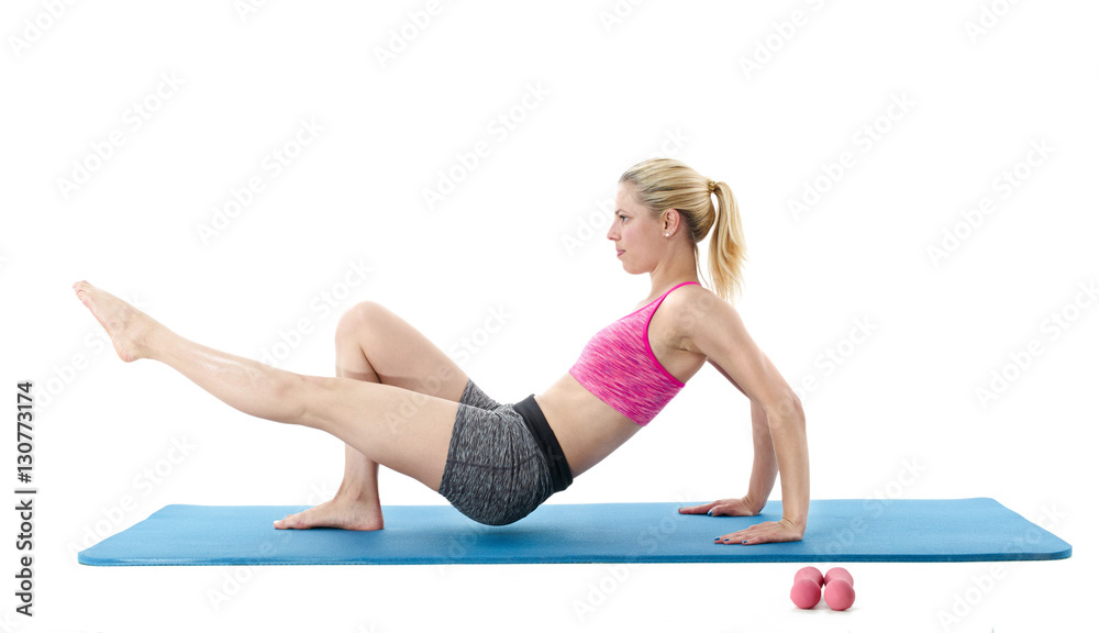 Woman exercising with stretching on the mat Woman exercising with stretching on the mat