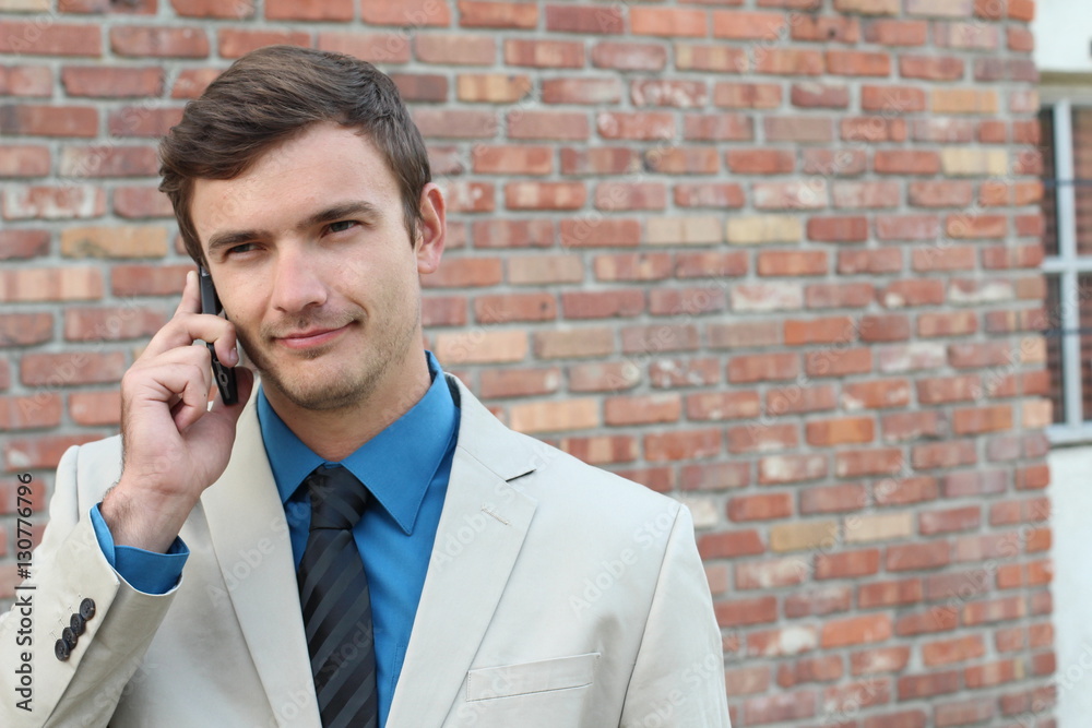 Businessman showing mistrust during phone call Businessman showing mistrust during phone call