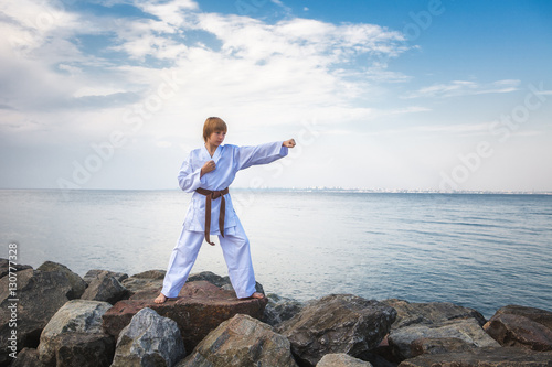 Young boy training karate