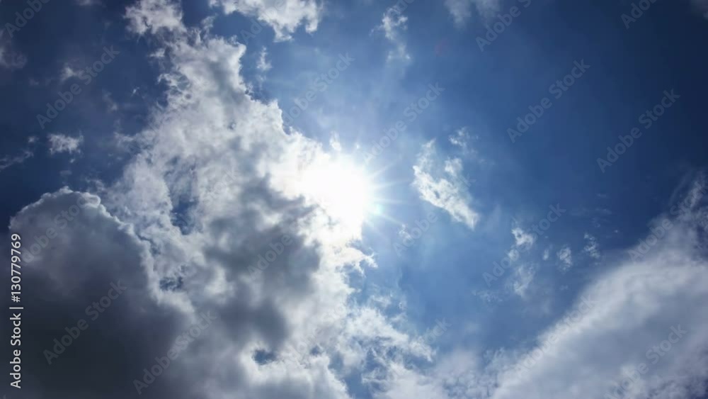 Moving clouds under the sun at sky Moving clouds under the sun at sky