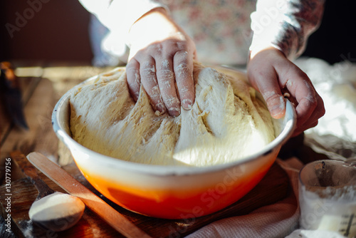 Close up view of baker kneading dough. Homemade bread. Hands pre