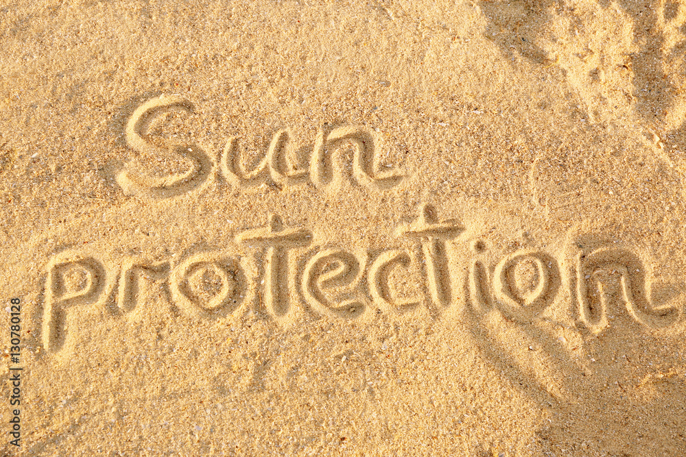 Fototapeta premium Handwritten inscription on sea sand, close up view