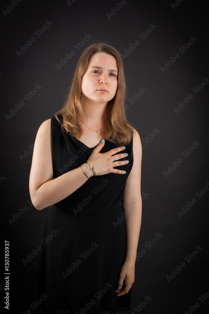 Beautiful woman doing different expressions in different sets of clothes: heart attack Beautiful woman doing different expressions in different sets of clothes: heart attack