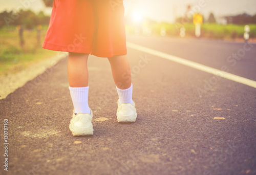 foot of a girl on the street asphalt