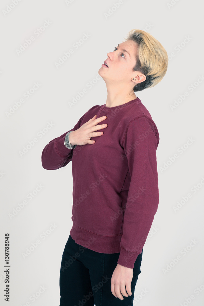 Beautiful woman doing different expressions in different sets of clothes: heart attack Beautiful woman doing different expressions in different sets of clothes: heart attack