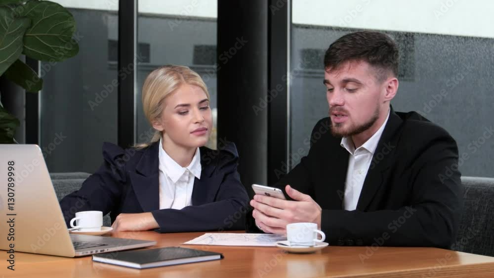 Businessman explains his subordinate what changes you need to make Businessman explains his subordinate what changes you need to make