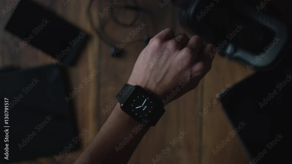 4k Technology Background of Businessman Turning on his Smartwatch 4k Technology Background of Businessman Turning on his Smartwatch