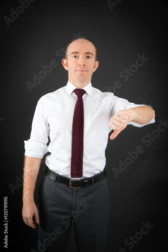 Handsome Man doing different expressions in different sets of clothes: thumbs down