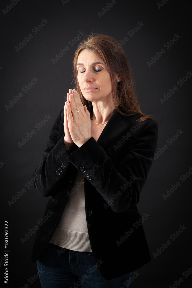 Beautiful woman doing different expressions in different sets of clothes: prayer Beautiful woman doing different expressions in different sets of clothes: prayer