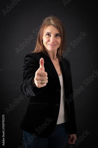 Beautiful woman doing different expressions in different sets of clothes: thumbs up
