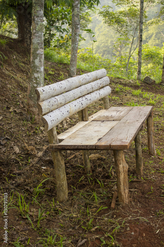 Wooden bench in a hillside park