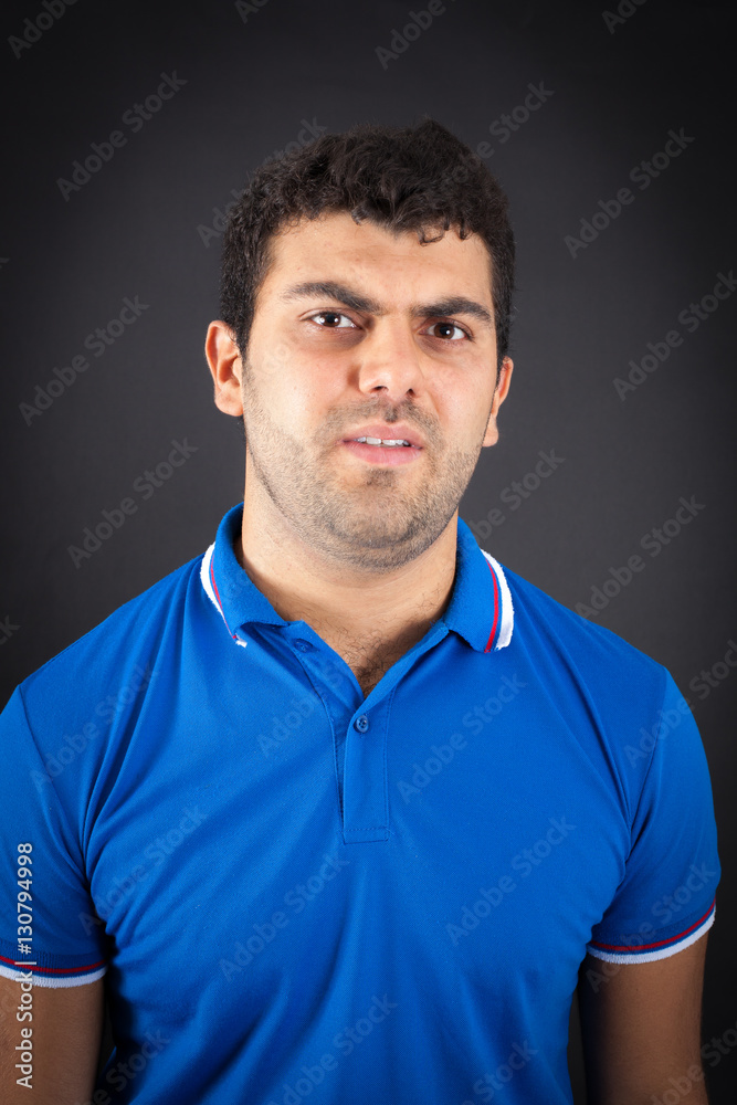 Handsome man doing different expressions in different sets of clothes: angry Handsome man doing different expressions in different sets of clothes: angry
