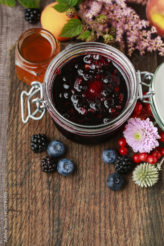 Jar of jam and autumn fruits