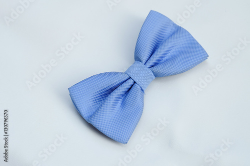 Blue bow on white