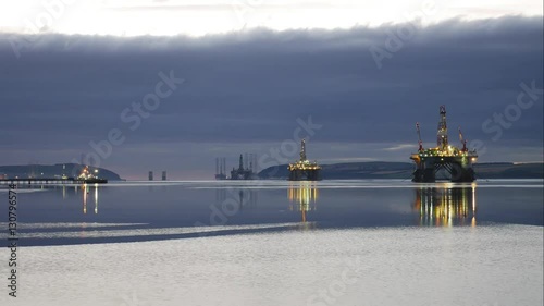 Timelapse of Silhouette of Semi Submersible Oil Rig and Big Boat at Cromarty Firth in Invergordon, Scotland (4K Timelapse)
 photo