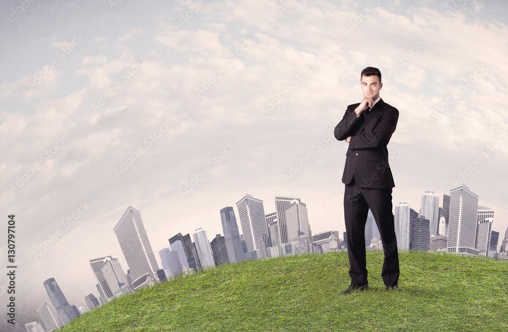 man standing in front of city landscape man standing in front of city landscape