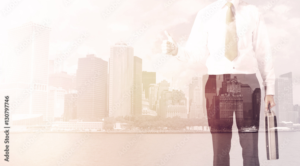 Businessman standing at cityscape background Businessman standing at cityscape background