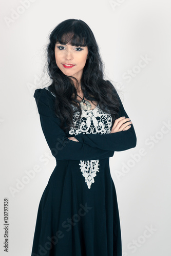 Beautiful woman doing different expressions in different sets of clothes: arms crossed