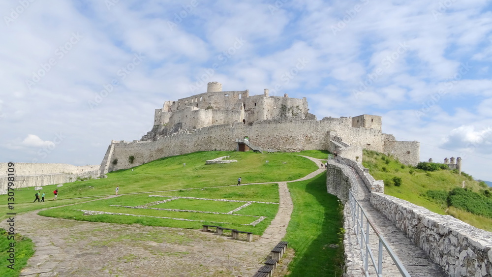 Inside the walls of Spis Castle with panorama of meadows - Spissky hrad National Cultural Monument (UNESCO) ruins of medieval castle, Slovakia Inside the walls of Spis Castle with panorama of meadows - Spissky hrad National Cultural Monument (UNESCO) ruins of medieval castle, Slovakia