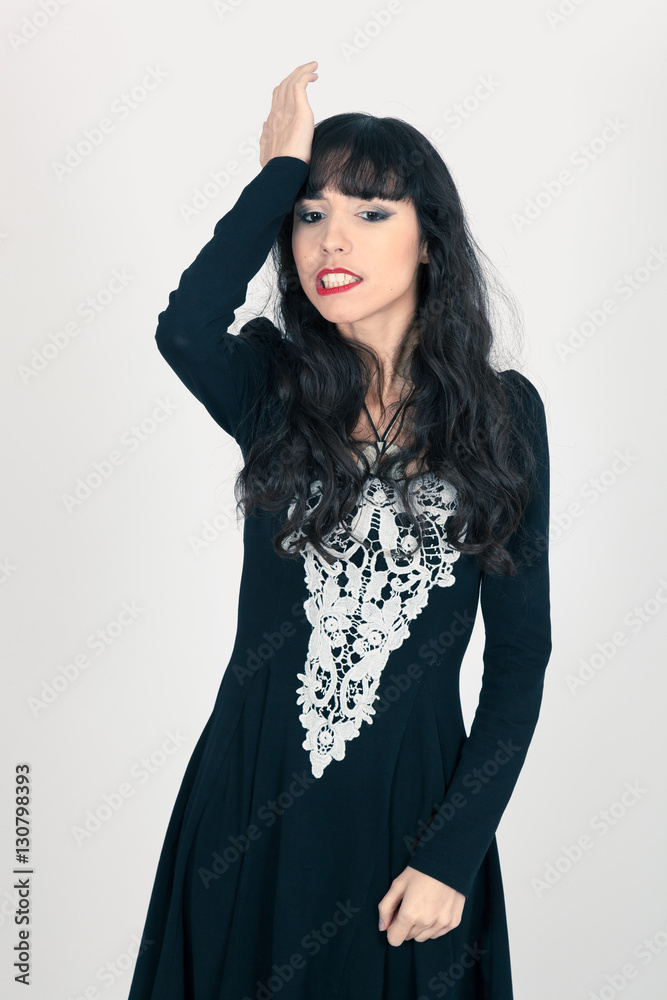 Beautiful woman doing different expressions in different sets of clothes: headache Beautiful woman doing different expressions in different sets of clothes: headache