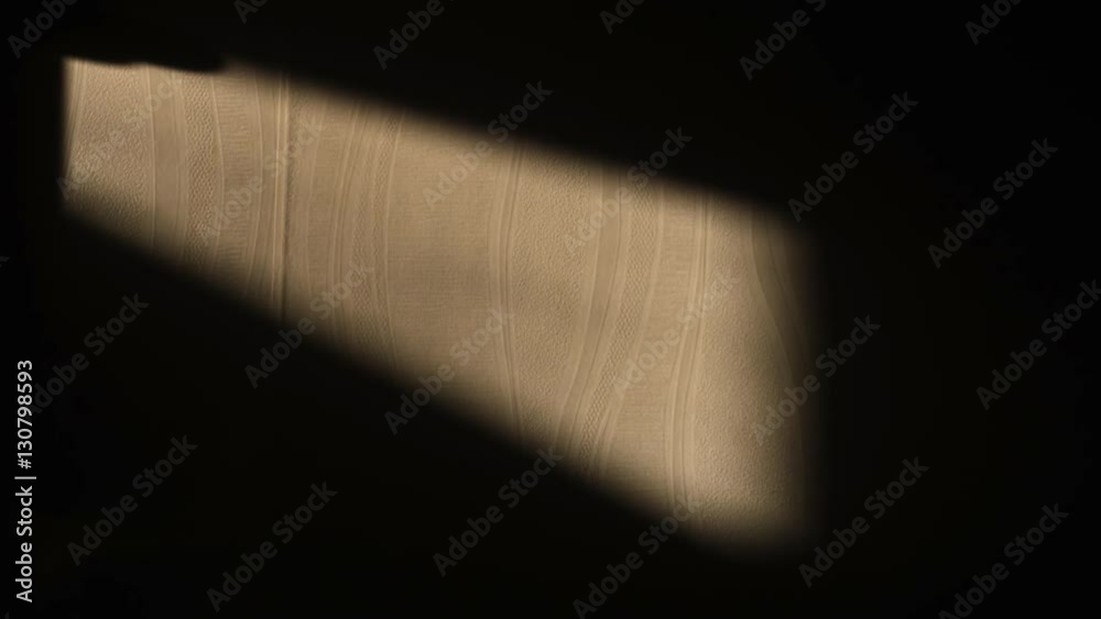 Entering window light with changing ray on the wall
