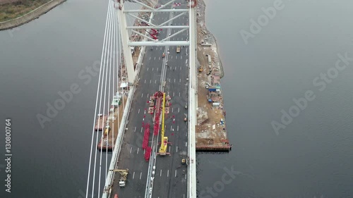 Aerial top view of modern multi lane cable-stayed bridge at the day time photo