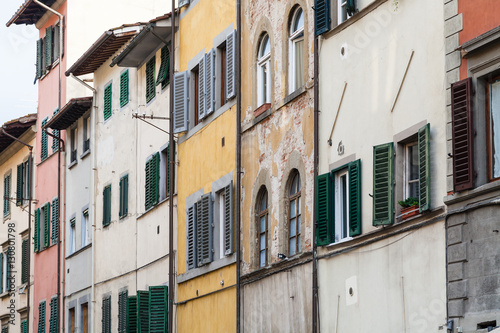 facades of old shabby houses in Florence