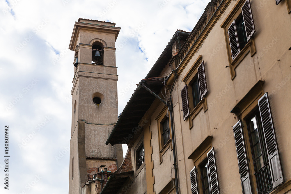 bell tower over old houses in Florence