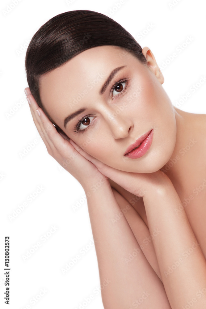 Young beautiful healthy happy woman touching her face over white background Young beautiful healthy happy woman touching her face over white background