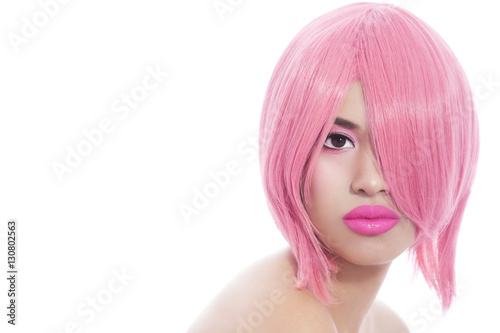 Young beautiful asian girl with stylish pink bob haircut over white background