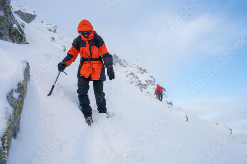 Mountaineering. Teamwork in alpinism. Traverse of mountain.