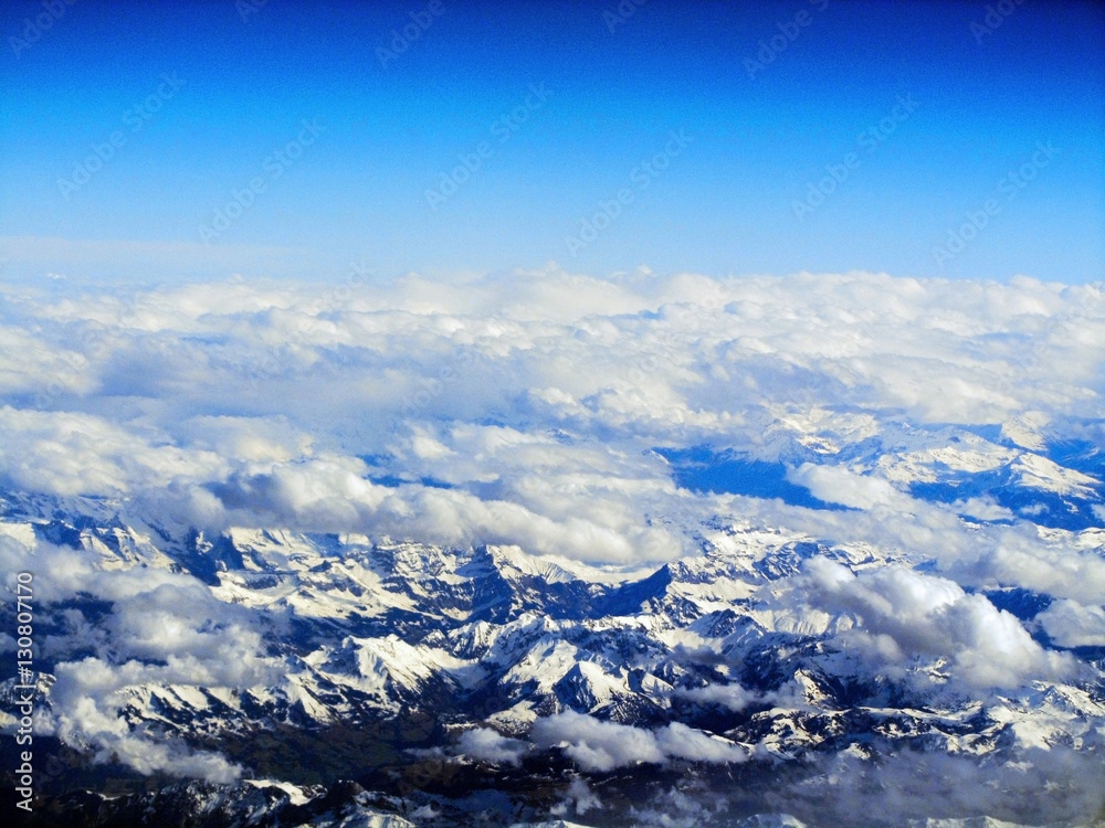 Swss Alps covered in snow - an aerial view from plane