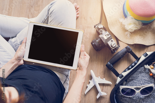 Women using tablet and prepare to travel on holiday