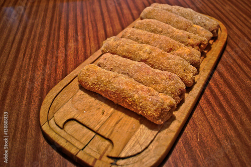 Stuffed karadjordje schnitzels on a cutting board