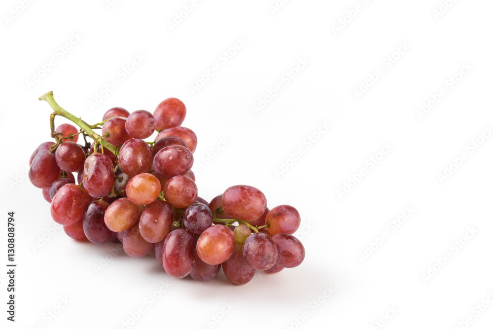 Fresh purple grapes on a white background