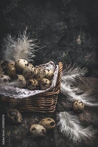 Fototapeta Naklejka Na Ścianę i Meble -  Quail eggs in Basket on dark wooden background