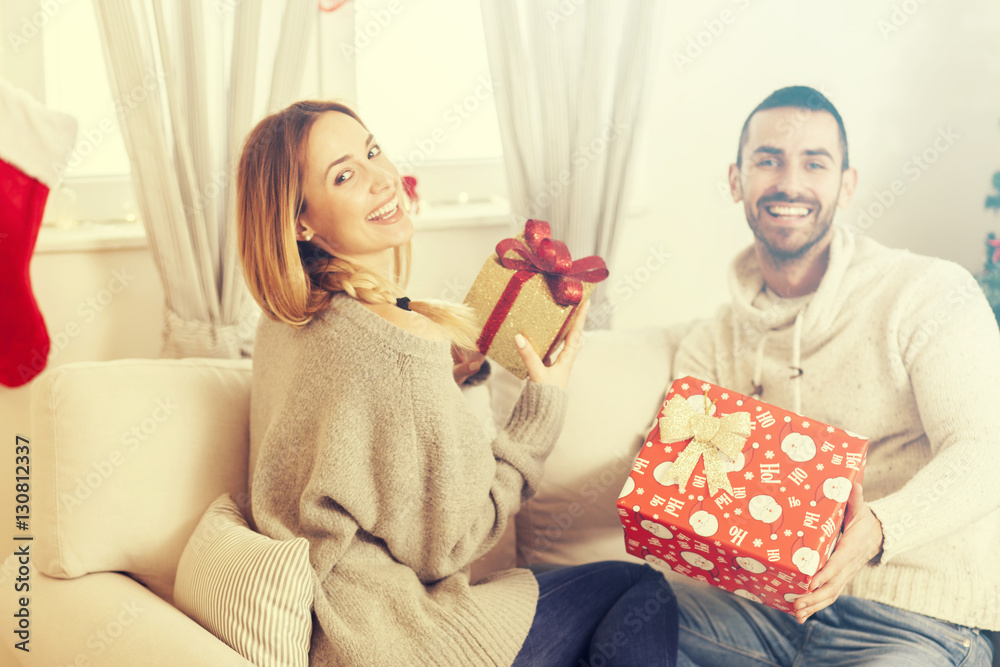 Couple in love with Christmas present Couple in love with Christmas present